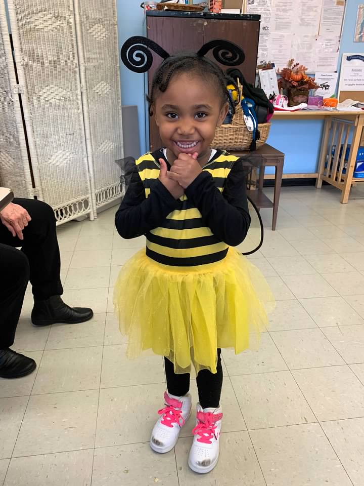 little girl wearing a costume