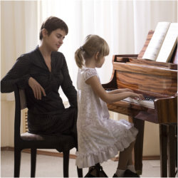 little girl doing piano
